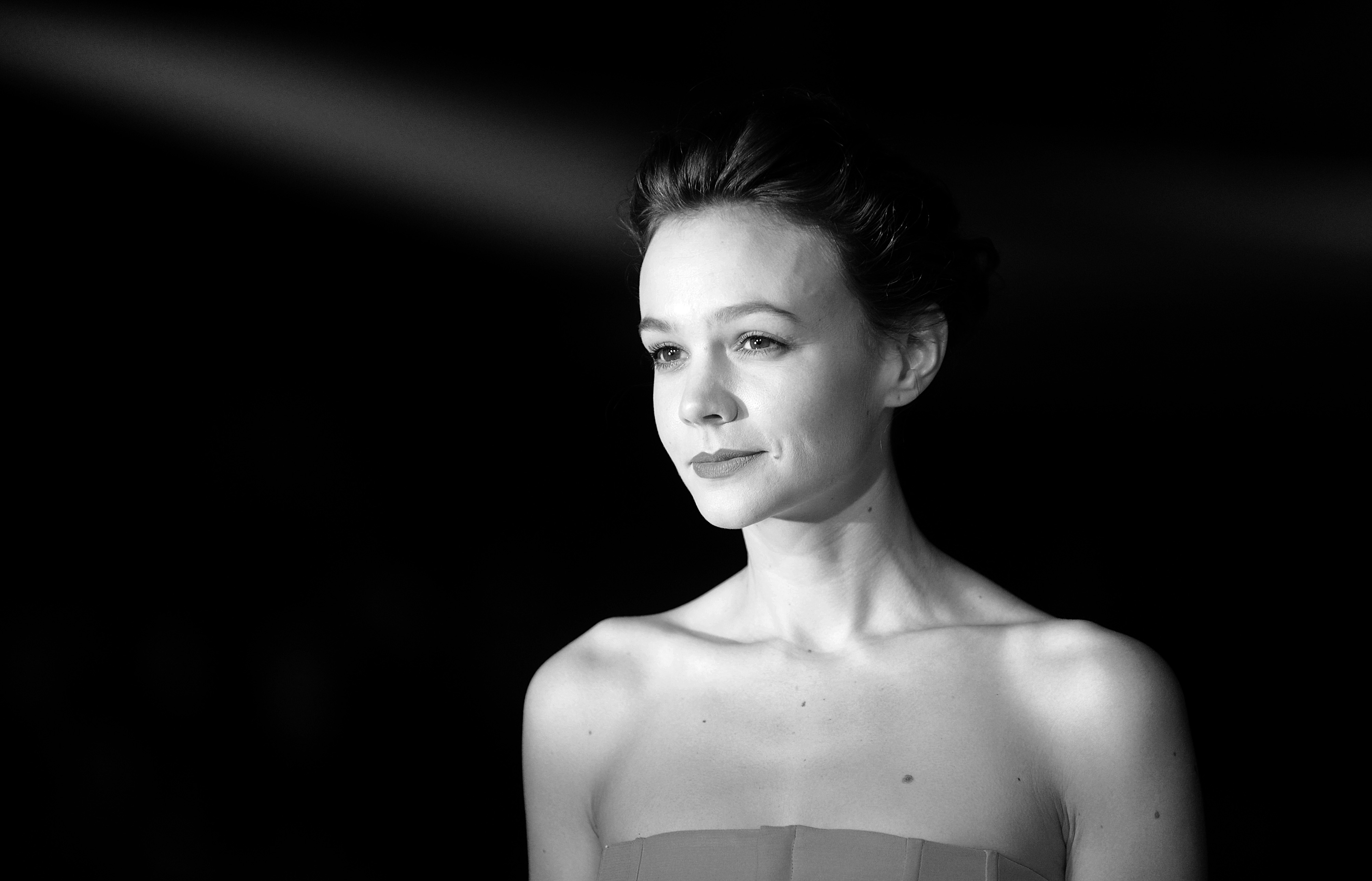 LONDON, UNITED KINGDOM - OCTOBER 15: (EDITORS NOTE: This image has been converted to black and white) Carey Mulligan attends the screening of "Inside Llewyn Davis" Centrepiece Gala Supported By The Mayor Of London during the 57th BFI London Film Festival at Odeon Leicester Square on October 15, 2013 in London, England. (Photo by Stuart C. Wilson/Getty Images for BFI)