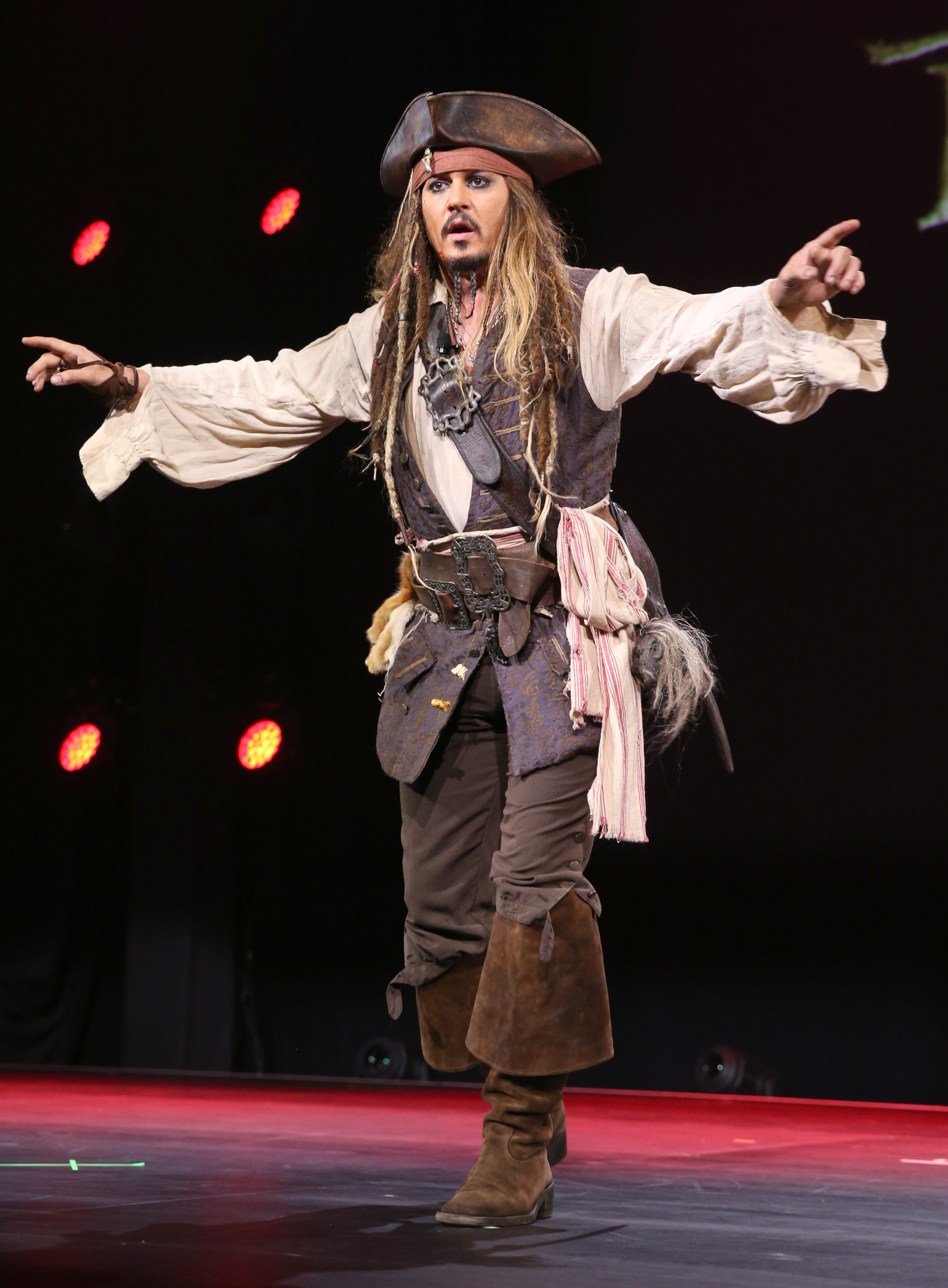 ANAHEIM, CA - AUGUST 15: Actor Johnny Depp, dressed as Captain Jack Sparrow, of PIRATES OF THE CARIBBEAN: DEAD MEN TELL NO TALES took part today in "Worlds, Galaxies, and Universes: Live Action at The Walt Disney Studios" presentation at Disney's D23 EXPO 2015 in Anaheim, Calif. (Photo by Jesse Grant/Getty Images for Disney)