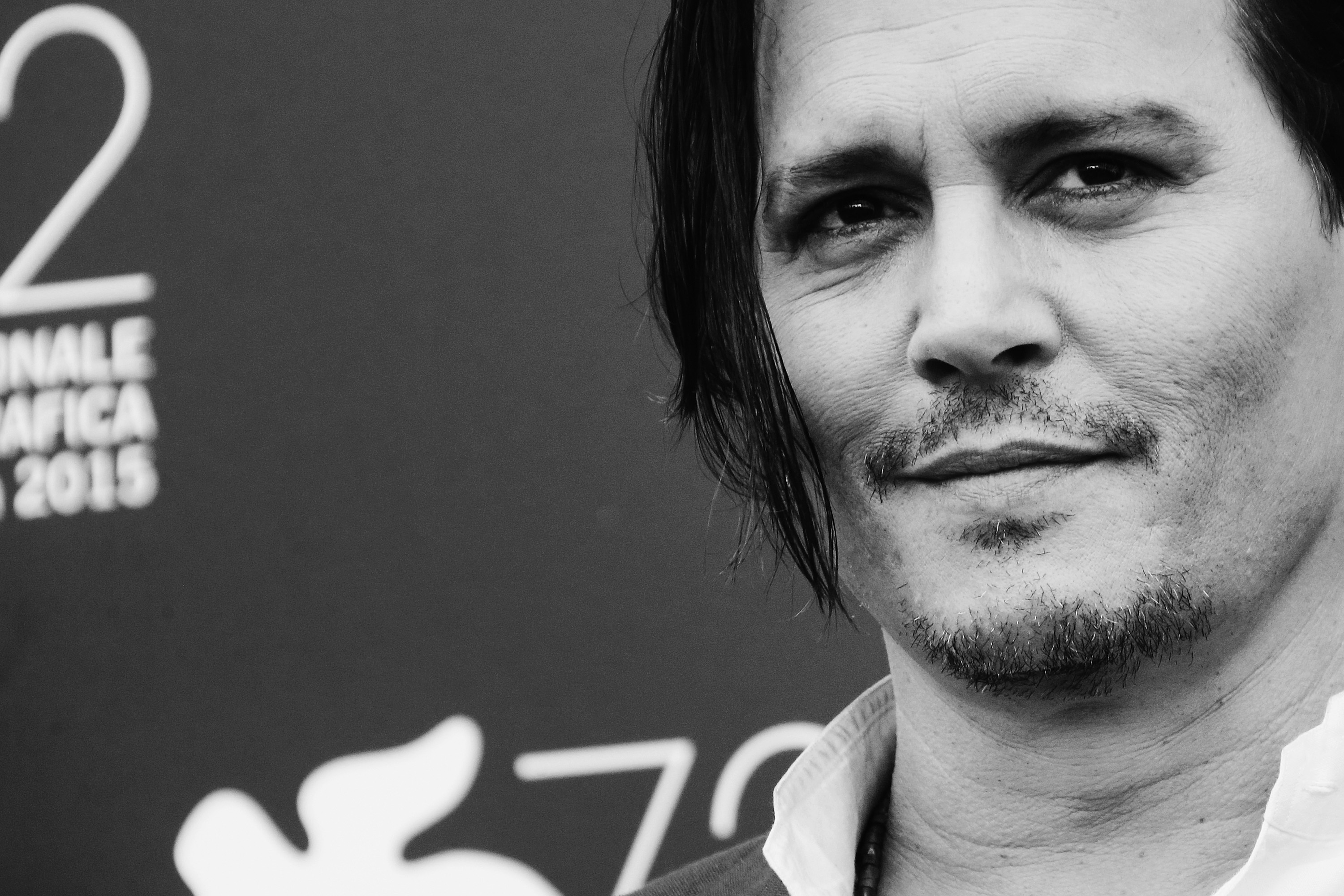 VENICE, ITALY - SEPTEMBER 04: (EDITORS NOTE: Image has been converted to black and white)Johnny Depp attends the 'Black Mass' photocall during the 72nd Venice Film Festival on September 4, 2015 in Venice, Italy. (Photo by Vittorio Zunino Celotto/Getty Images)