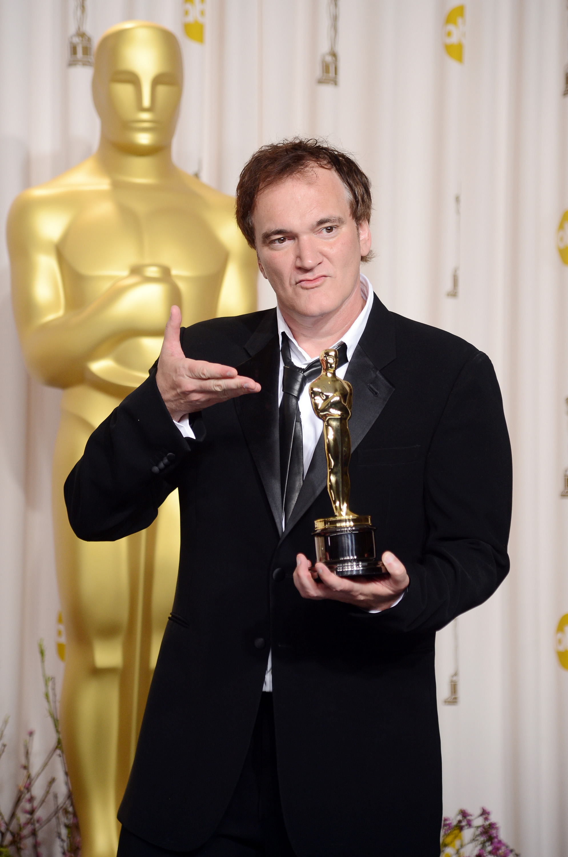 HOLLYWOOD, CA - FEBRUARY 24: Writer-director Quentin Tarantino, winner of the Best Original Screenplay award for "Django Unchained," poses in the press during the Oscars held at Loews Hollywood Hotel on February 24, 2013 in Hollywood, California. (Photo by Jason Merritt/Getty Images)