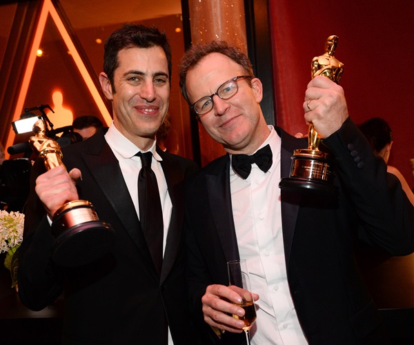 Josh Singer, left, and Tom McCarthy, winners of the award for best original screenplay for Spotlight, attend the Governors Ball after the Oscars on Sunday, Feb. 28, 2016, at the Dolby Theatre in Los Angeles. (Photo by Al Powers/Invision/AP)