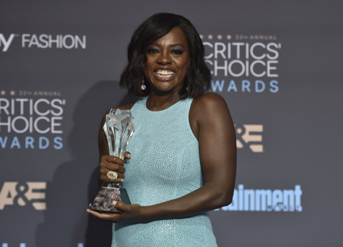 Viola Davis poses in the press room with the award for best supporting actress for "Fences" at the 22nd annual Critics' Choice Awards at the Barker Hangar on Sunday, Dec. 11, 2016, in Santa Monica, Calif. (Photo by Jordan Strauss/Invision/AP) ORG XMIT: CADA370