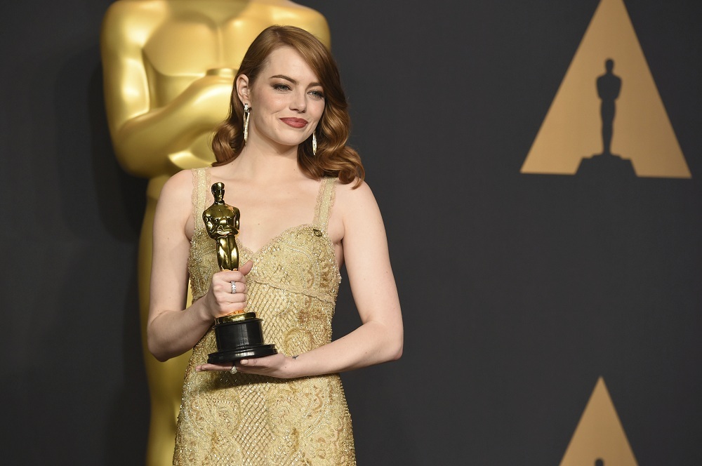 Emma Stone poses in the press room with the award for best actress in a leading role for "La La Land" at the Oscars on Sunday, Feb. 26, 2017, at the Dolby Theatre in Los Angeles. (Photo by Jordan Strauss/Invision/AP)